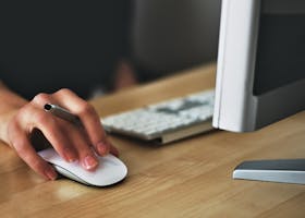 Person Holding Apple Magic Mouse